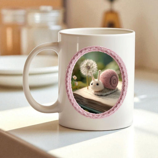 Felt snail 11 oz ceramic coffee mug with soft pink nature inspired design