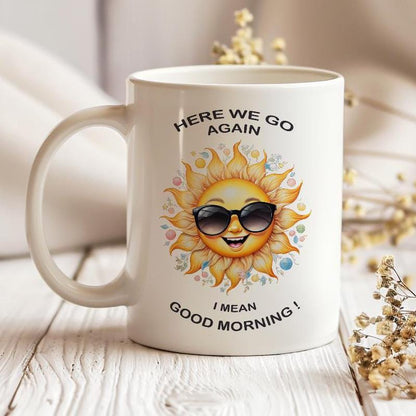 Funny sunshine 11 oz ceramic coffee mug with “Here We Go Again” text design