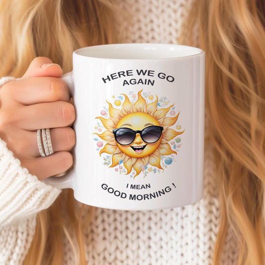 Funny sunshine 11 oz ceramic coffee mug with “Here We Go Again” text design